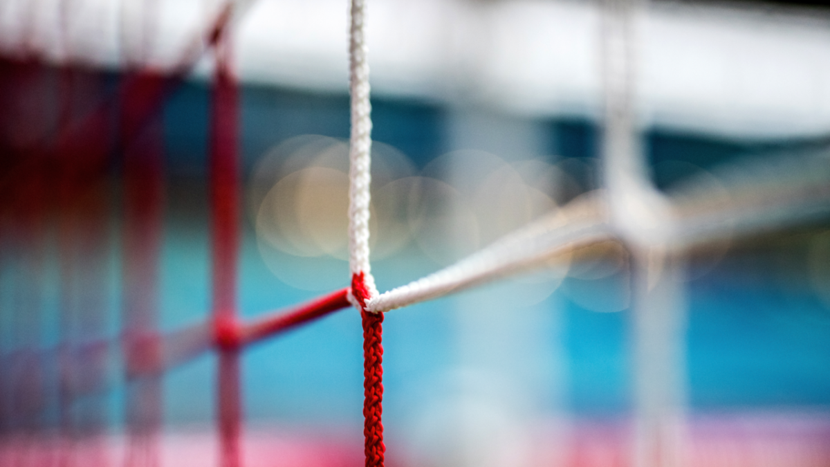 Macro of a football goal net.