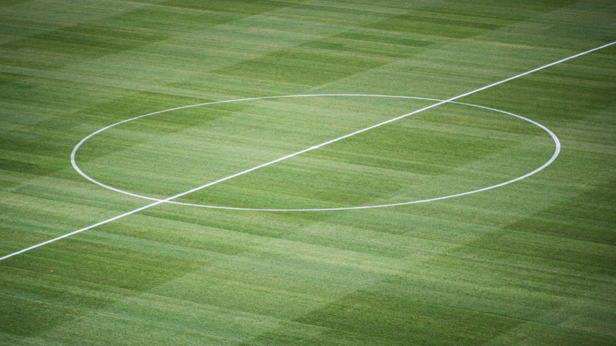 Centre circle on the pitch of a football field.